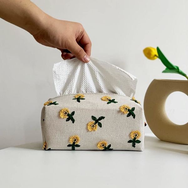 Blomsterbroderi på tissueske