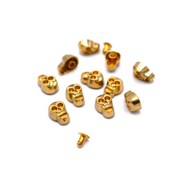 Løse nagler står mot gullfargede 40 stk Gold