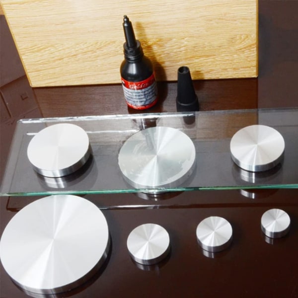 4 stk. 40 mm diameter og 8 mm tykke sølvfarvede aluminiumsadaptere til montering af bordben