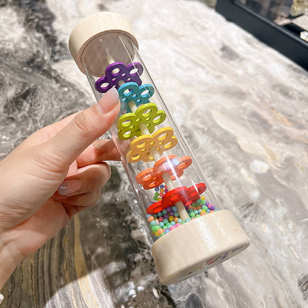 Plast rör med boll sensoriskt hörselinstrument uppslukande regn