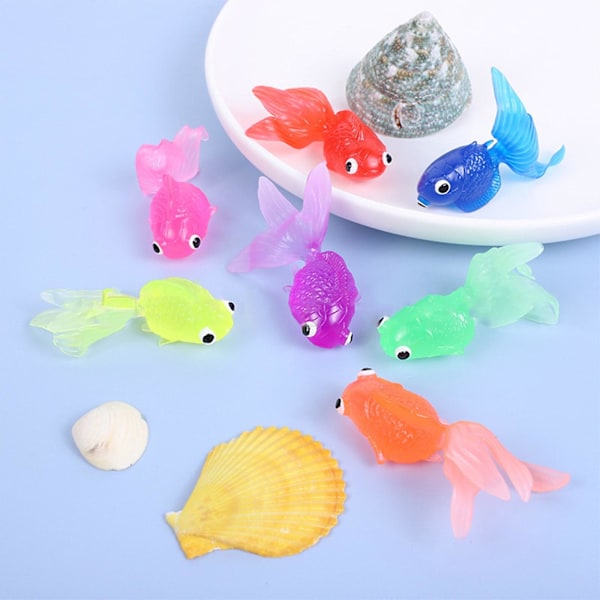 Mardi Gras-gåvor 7 st flytande simuleringsguldfisk 6,3 cm genomskinlig mjuk TPR flytande marin barnfisk fiskeleksak 242680[C]