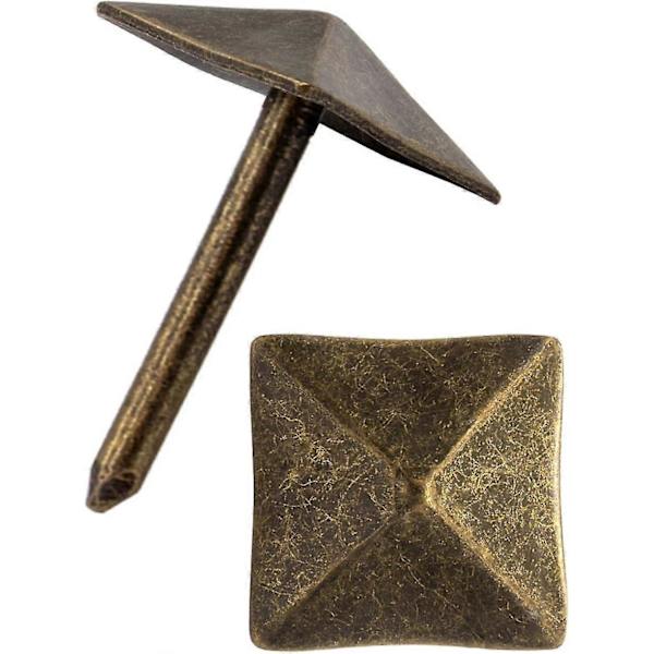 Set med 40 dekorativa spikar i åldrad bronsmässing 12 x 18 mm