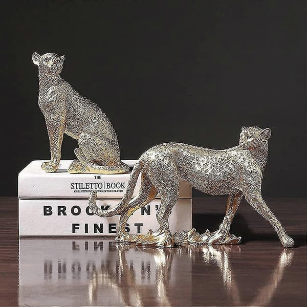 Moderne gepardfigur i polyresin til boligindretning (siddende, guld)