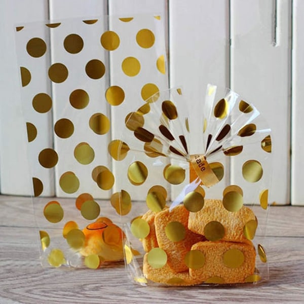 50 ruusukulta lahjapussia kierretyillä läpinäkyvillä paperipusseilla gold