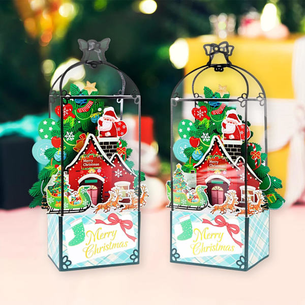 Kaksi kappaletta 3D joulukortteja pop-up-mallissa. Joulukortteja