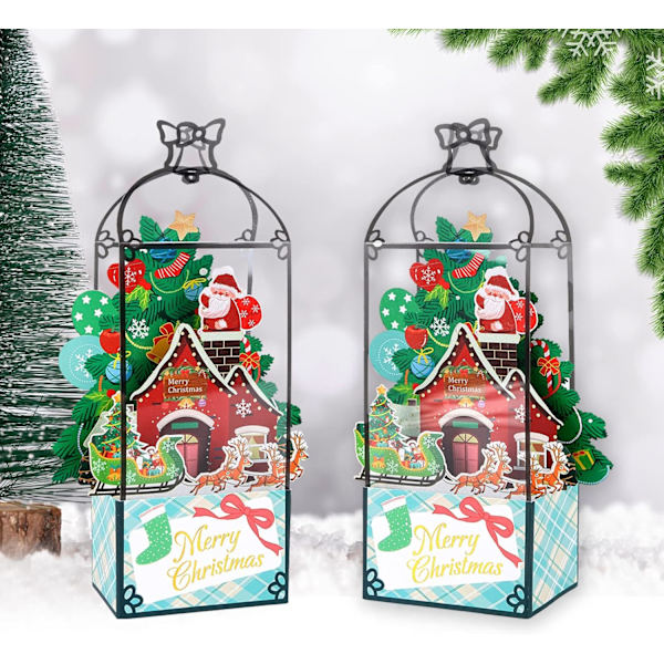 Kaksi kappaletta 3D joulukortteja pop-up-mallissa. Joulukortteja
