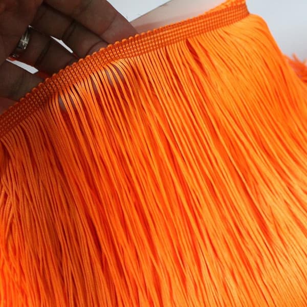 Oransje dusker vevd polyester sydd sateng blonder, brukt i klær,
