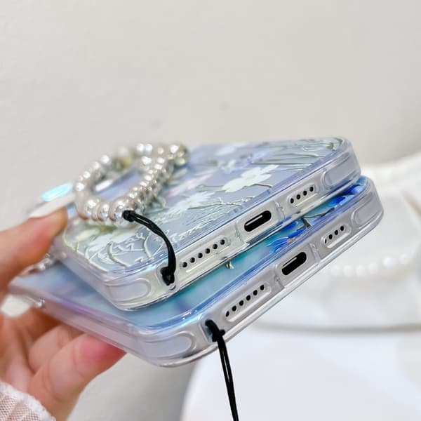 iPhone 16 Pro Max Skal med Elektroplätering och Laserblomma samt Handledsrem Blomma AH6