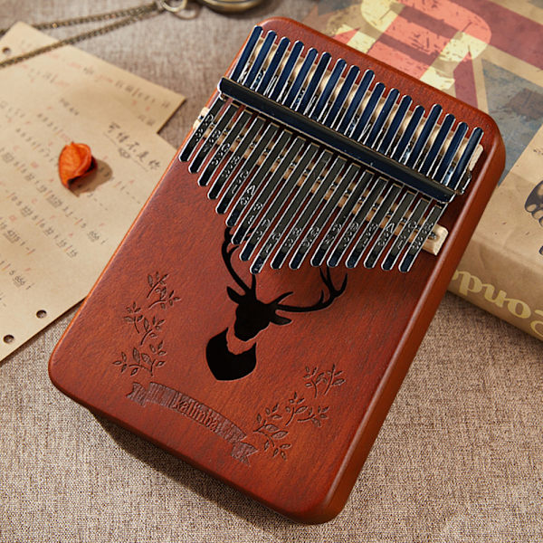 17-tangenters kalimba tommelfingerklaver; stemhammer, fingerdæksler, nøgle