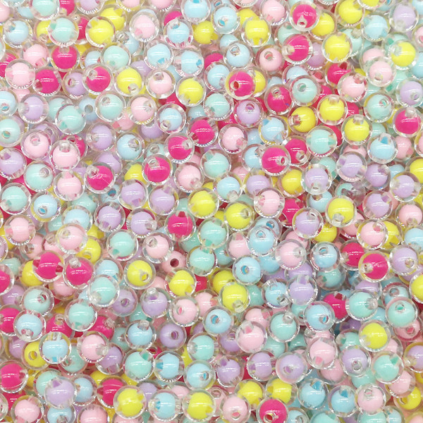 Ett paket akrylfärgade pärlor i tre storlekar - transparenta