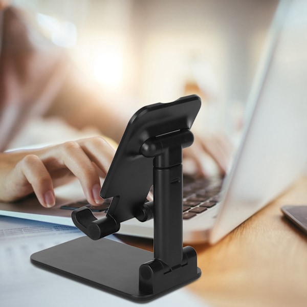 Taitettava ja monitoiminen matkapuhelinteline pöydälle, sopii draaman katseluun ja tablettien käyttöön, musta