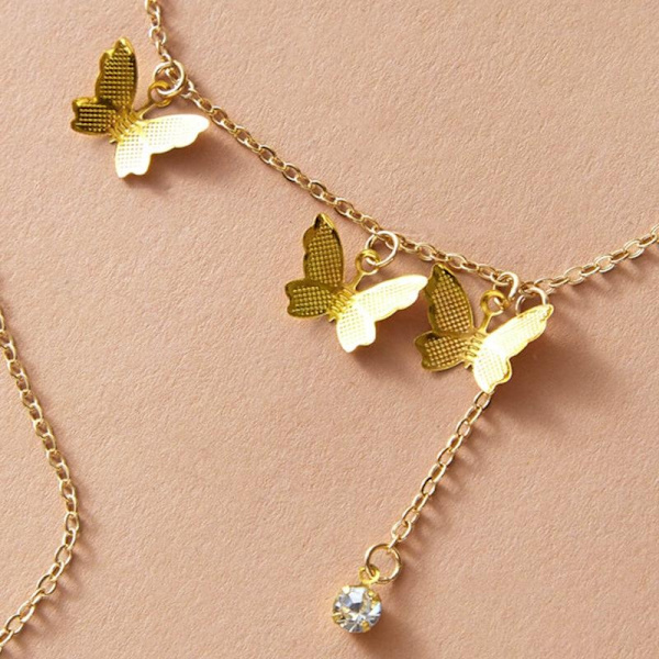 Halsband med Fina Mönstrade Fjärilar i Guld färg