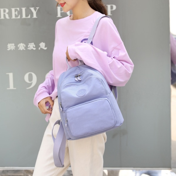 Design Skolväska för tonårsflicka 2021 Kvinnor Ryggsäck Resor Casual Axelväskor Dam Nylon ryggsäck Svart handväska Purple purse