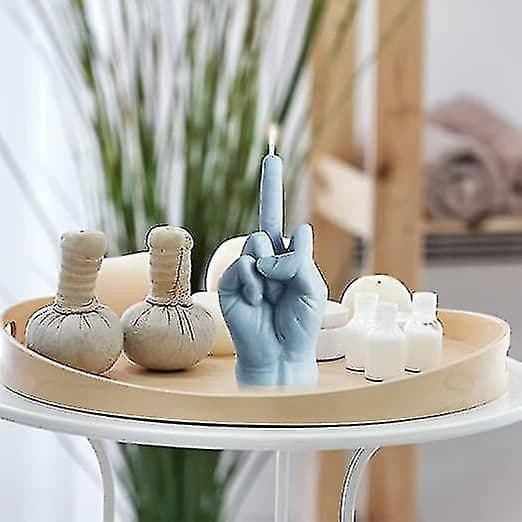 Kreative duftlys formet som en langfingergest blue