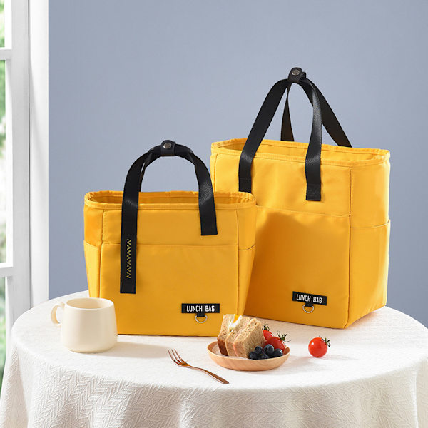 Eristetyt Bento-lounaslaukut suuren kapasiteetin vetoketjulla yellow 27*15*28cm