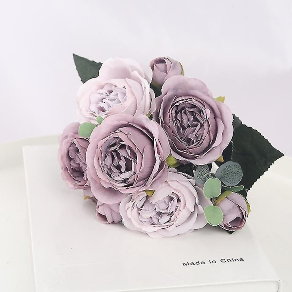 Vekokukkakoristeet olohuoneen ruokapöydällä, keinotekoinen ruusukimppu (violetti)