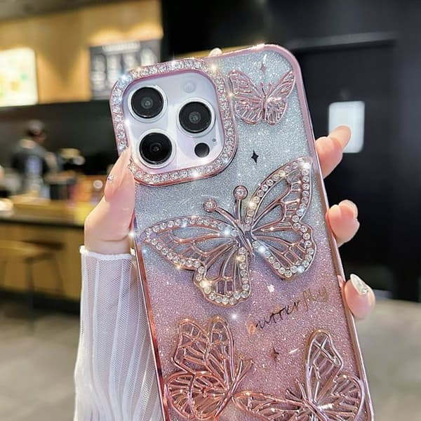Et etui til iPhone 17 Pro Max med et glitrende sommerfuglemønster, og et sødt og luksuriøst etui med glitrende diamanter (sort).