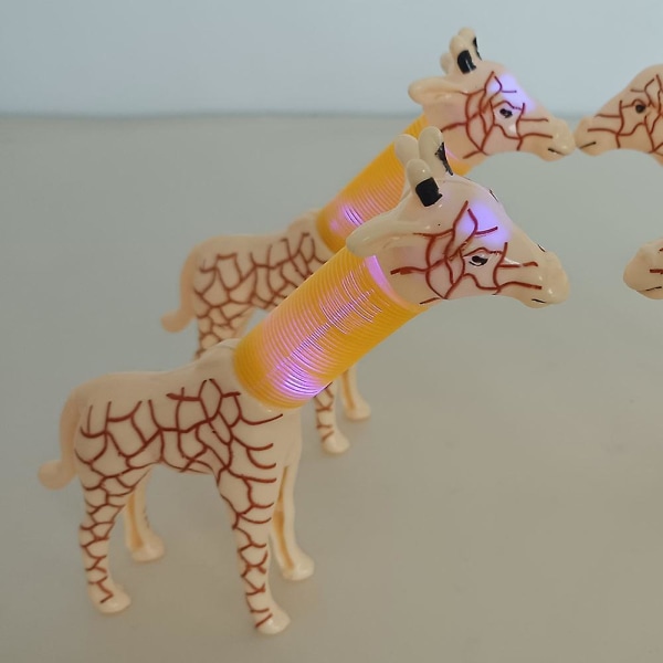2 stk giraffleketøy, teleskopisk, stadig skiftende med lys