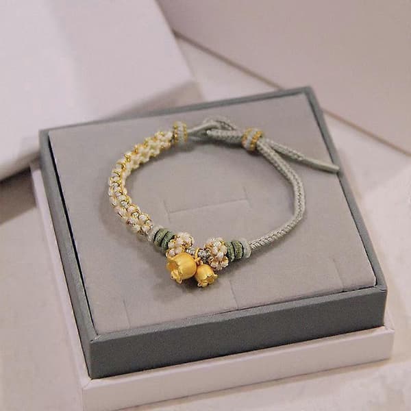 Handgjort flätat berlockarmband med blomma[DB]