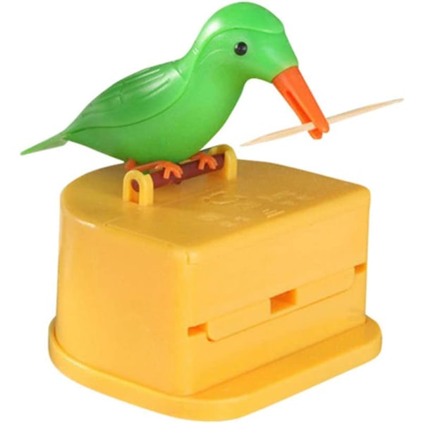 En tandstikdispenser i form af en sød fugl. rengøring af tænder grøn fugl med gul baggrund