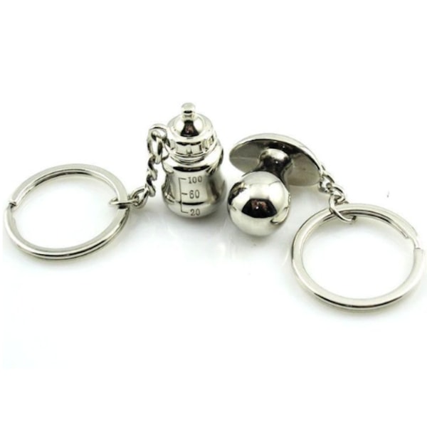 2-pack nyckelring, en med napp en med nappflaska silverfärgad Silver