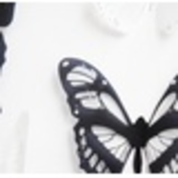 Ett ark med fjärilar, 18 st i olika storlekar i vitt och svart svart, grå, vit