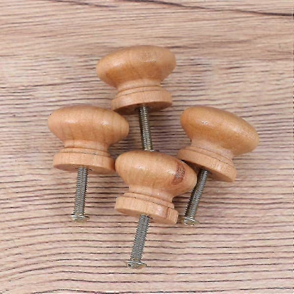 Et sett med 6 runde, soppformede knotter i tre, egnet for skapdører og skuffer.