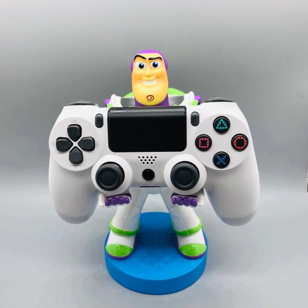 Hieno peli – Tyylikäs puhelinteline: Puun inspiroima Humanoidi-mobiiliteline ja peliohjaimen pidike Buzz Lightyear