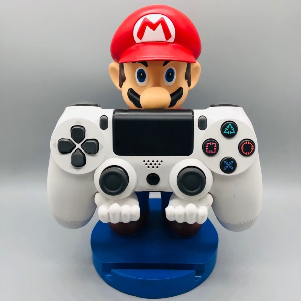 Hieno peli – Tyylikäs puhelinteline: Puun inspiroima Humanoidi-mobiiliteline ja peliohjaimen pidike Mario stå