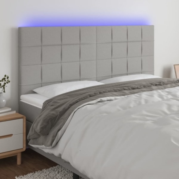 Sänggavel LED ljusgrå 200x5x118/128 cm tyg
