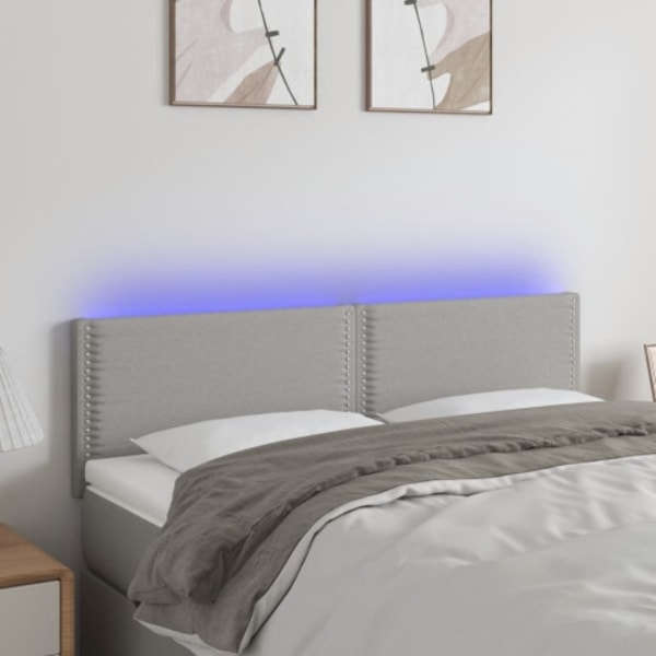 Sänggavel LED ljusgrå 144x5x78/88 cm tyg