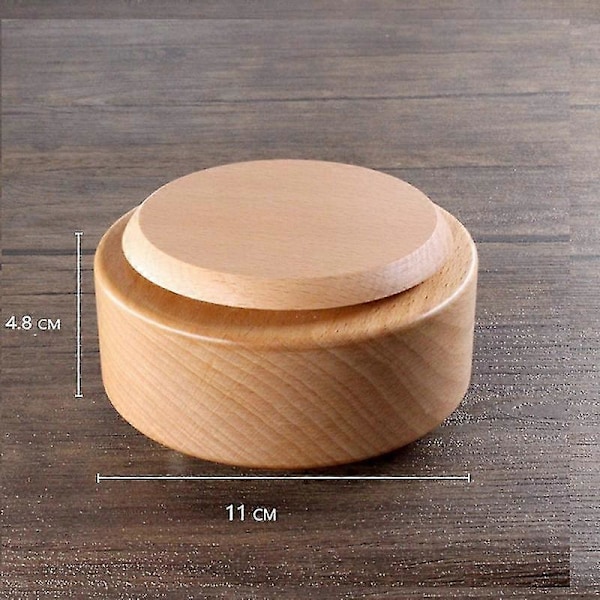 Puinen musiikkikello pyörivällä pohjalla DIY-taiteen ja käsityönä joulukoristeeksi