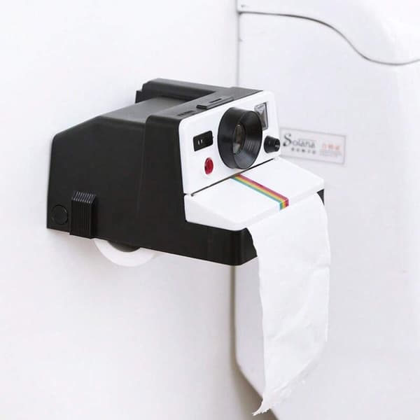 Sort og hvid retro kameraformet toiletpapirholder, ideel til badeværelses- og stueindretning.