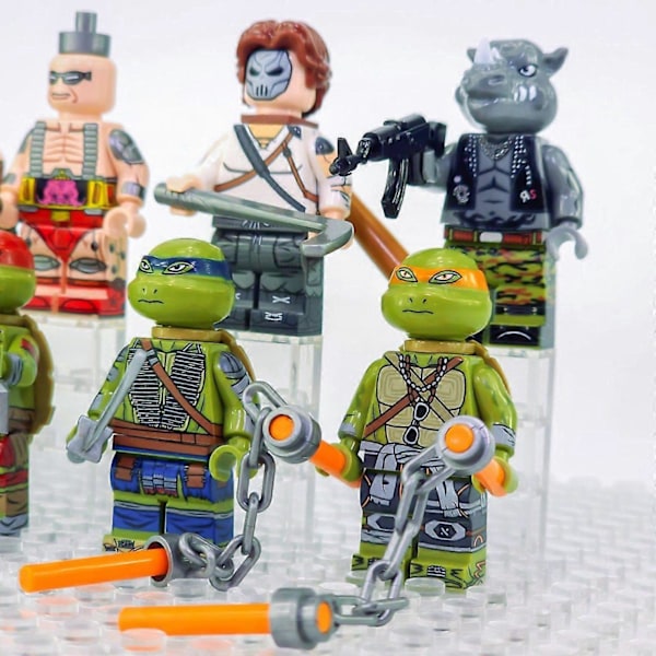 Teini-Mutanttininjakilpikonnat Minifiguurisetti Aseilla ja Tarvikkeilla
