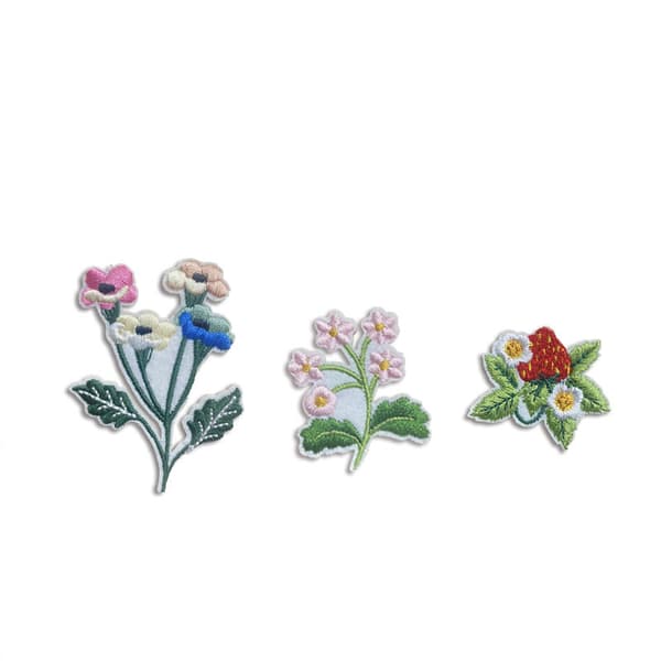 13 påstrykningsbroderimerker med hage-sommerfugldesign for