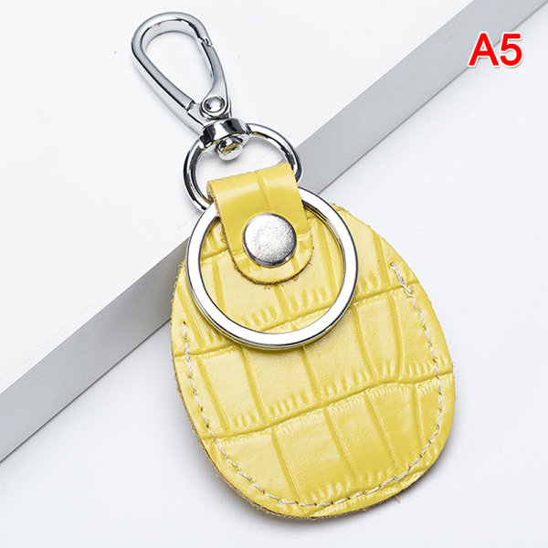 Kotelo Apple Airtagsille PIK Magnet Keychain Leather Cover C - spot ale Yellow