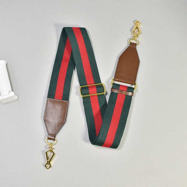 Yksi olkahihnainen crossbody-laukku, yleinen punainen ja sininen leveä olkahihna, punainen ja vihreä nauha, säädettävä pituus, vaihdettava laukkuhihna
