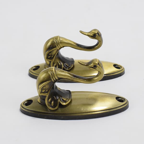 2 svan-stil gardinholdere - bronse