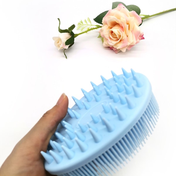 En pink og blå baby shampoo badebørste, 125 mm × 80 mm × 45 mm shampoo børste