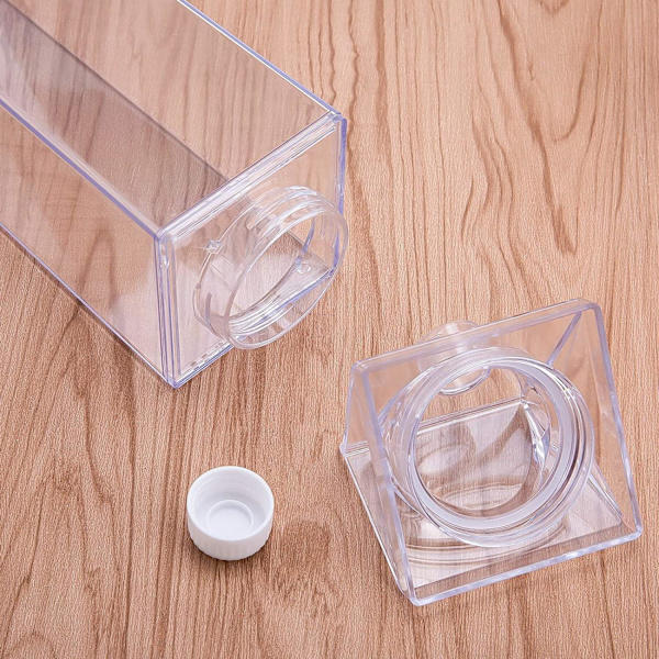 Läpinäkyvä neliönmuotoinen maitolasi, vuotamaton muovinen hedelmämehun pullo (läpinäkyvä/1000ml) ulkoilulajeihin, matkustamiseen, retkeilyyn ja vaellukseen.