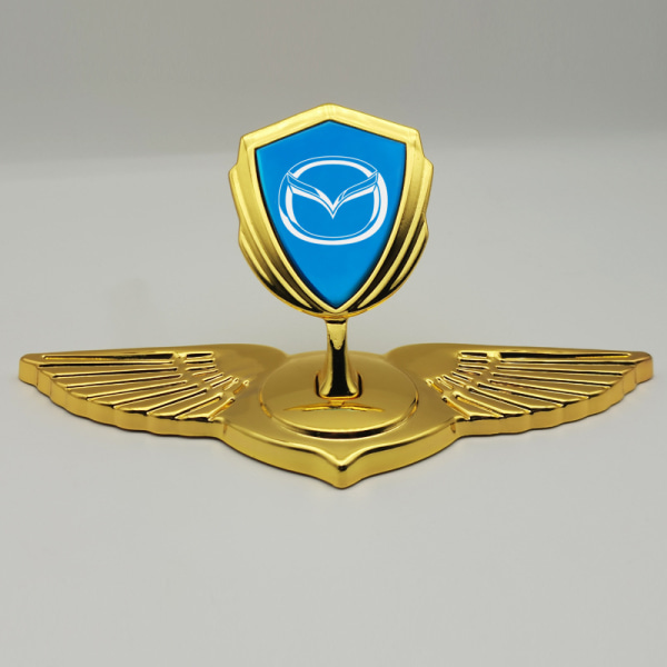 1 stycke lämplig för Mazda-huv och främre logotypmärke (guldblå)