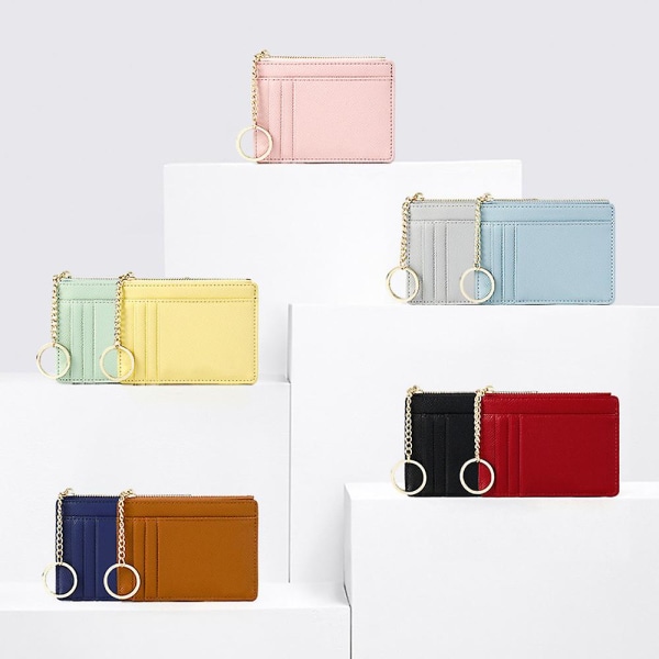 Enfärgad case, mininyckelring, liten plånbok