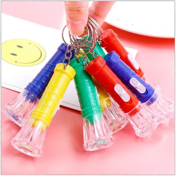 20 X Färgglada Mini Pocket Nyckelring Ficklampor Liten nyckelring Facklor Leksak för barn och vuxna
