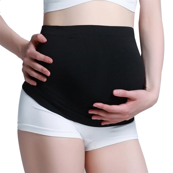 Svarta gravida kvinnor med elastiskt bukb?lte, ryggst?d,