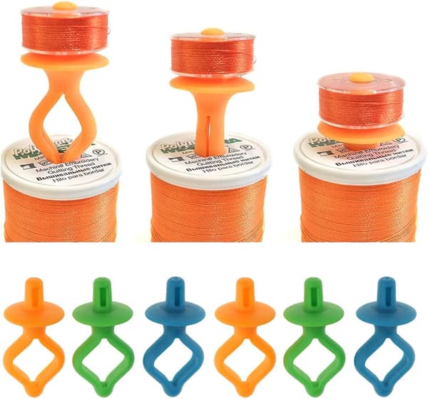 12 assorterede spolehæfter, clips, klemmer, farvede spolehæfter