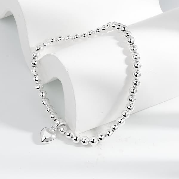 Sølvfarvede runde perler med hjertevedhæng, strækbart armbånd, S925