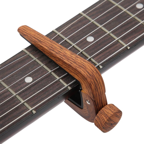 Gitarrstämnings capo FC-09 galvaniserad och oxiderad capo (mörkt trämönster) color 1