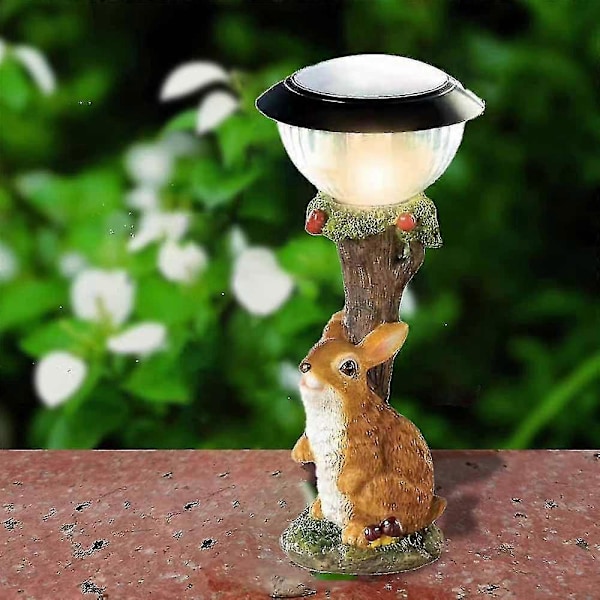 Hagestatuer med solcellelys, interessante hageskulpturer og hager, statuer i plener (ulike alternativer) rabbit