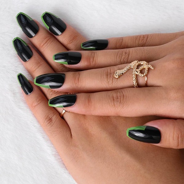 Svart och grön kontrastfärg bär manikyr falska naglar make up