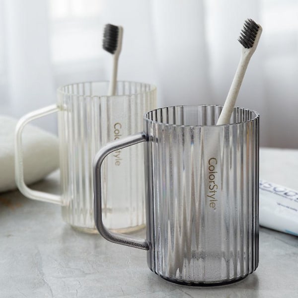 Sæt med 2 kopper og tandbørsteholdere 2 i 1 praktisk tandbørsteholder placeret på dit glas